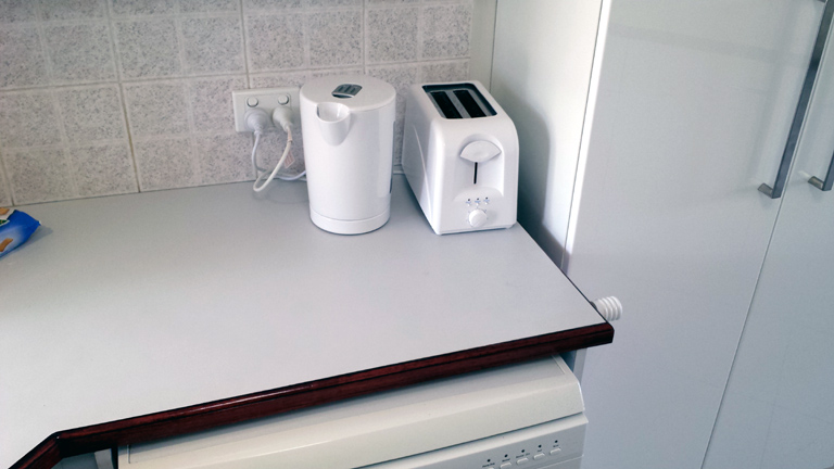 Kettle, toaster, above dishwasher